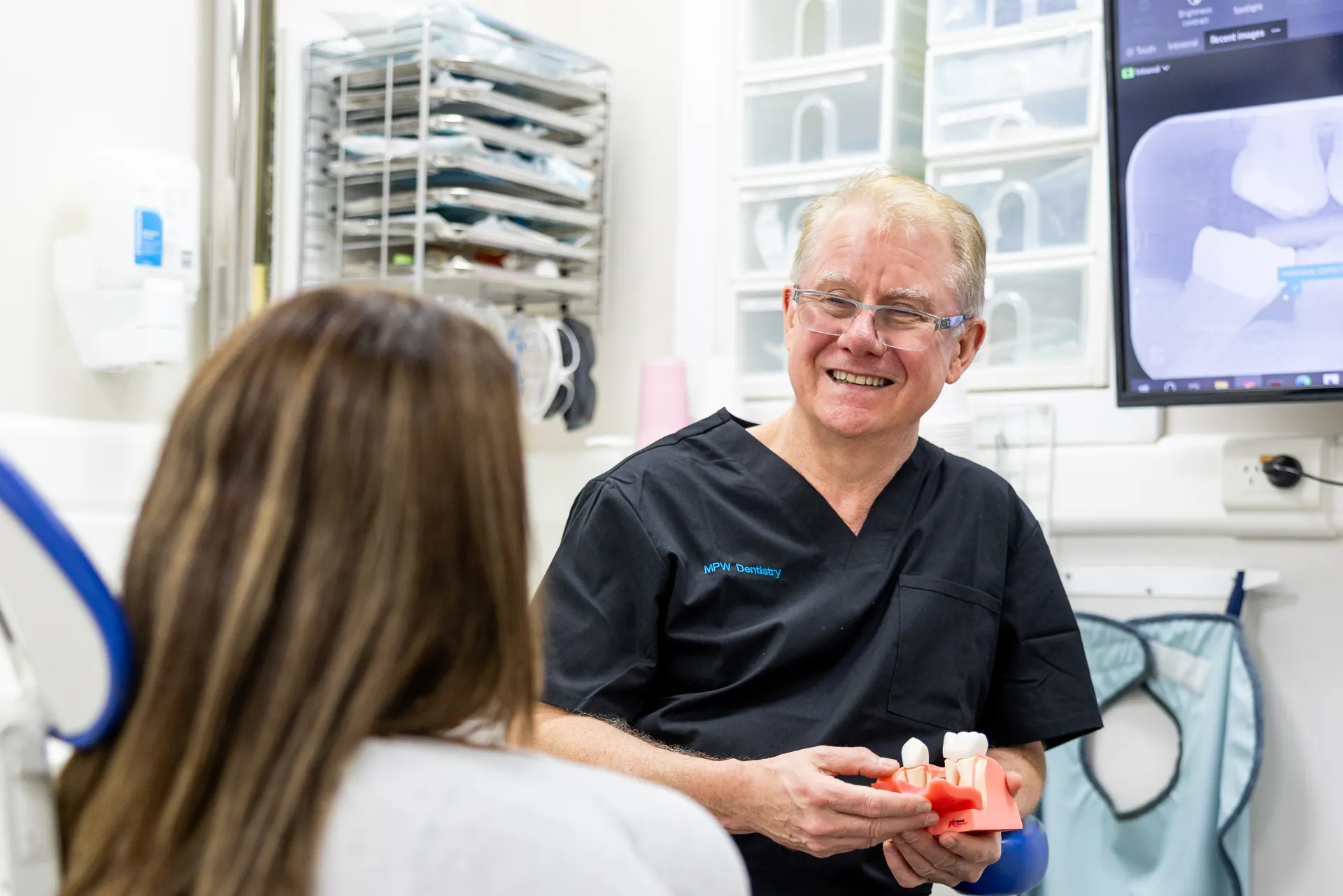 Dr Michael Walker consulting with patient